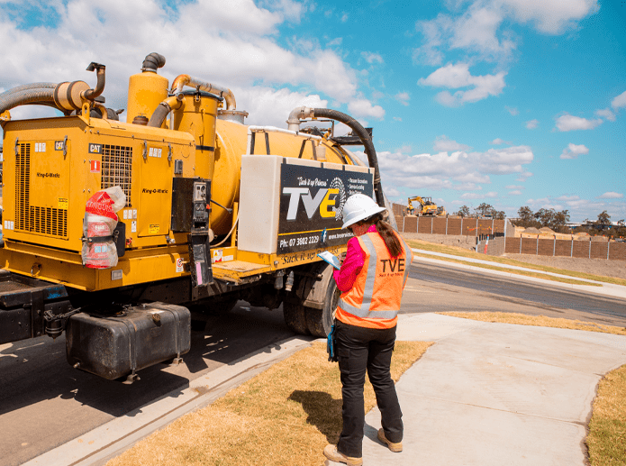 lady making notes about tve truck